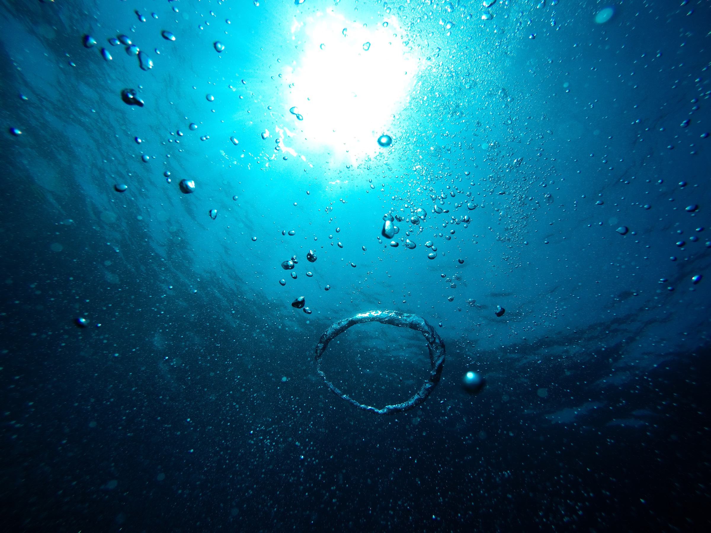 Sunlight through deep blue water