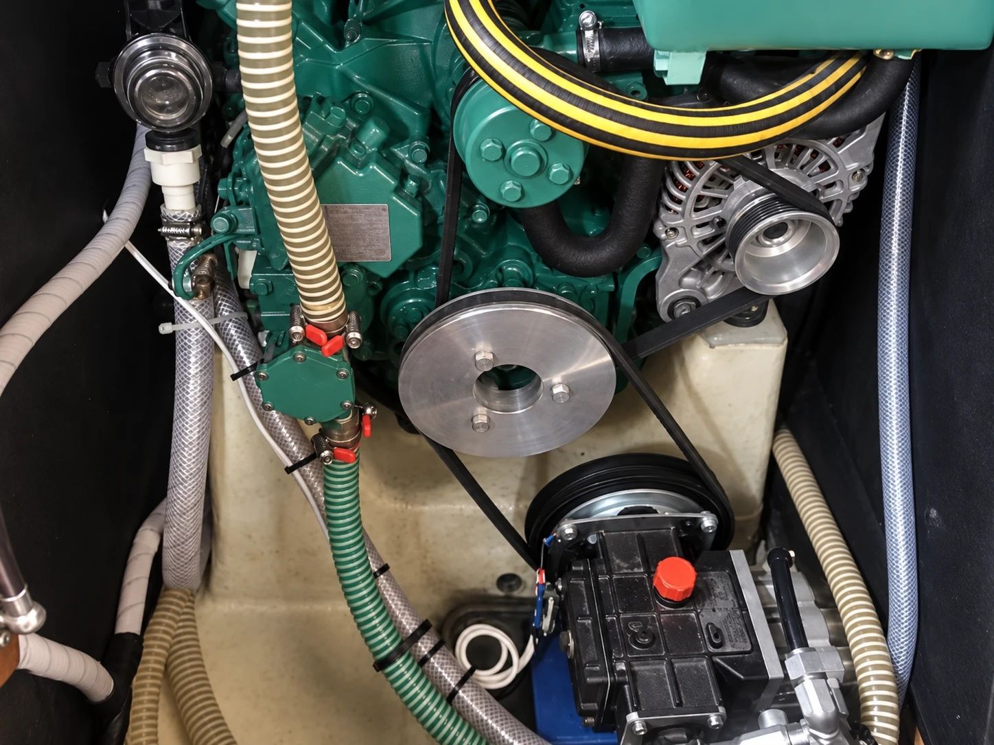 Engine Drive pump belted to the engine in an engine bay